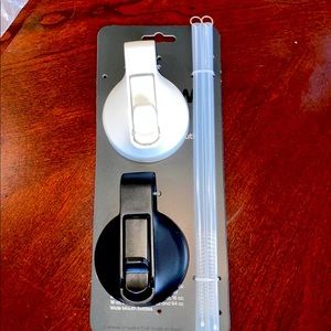 Hydro Flask lids with straws and cleaner.